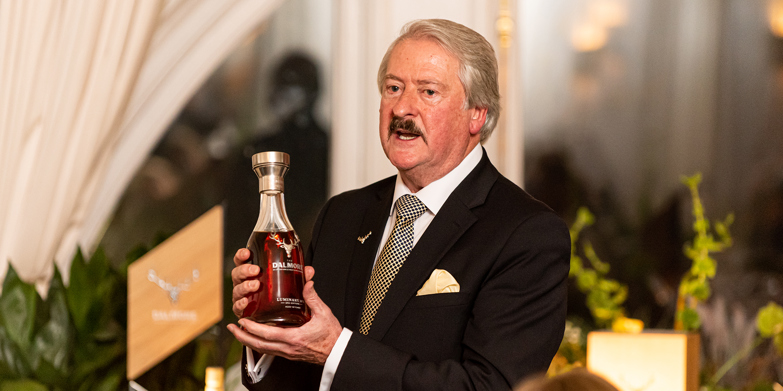 Richard Paterson holding a bottle